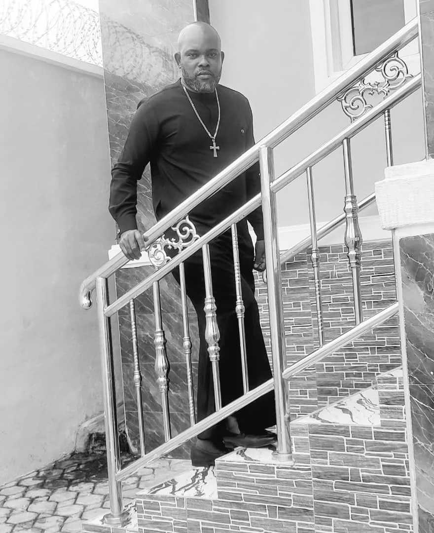 Isaac Nwaeze standing on a staircase